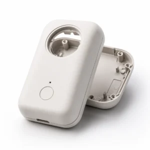 ABS consumer product housing with rounded shell internal mounting posts and clean surface finish