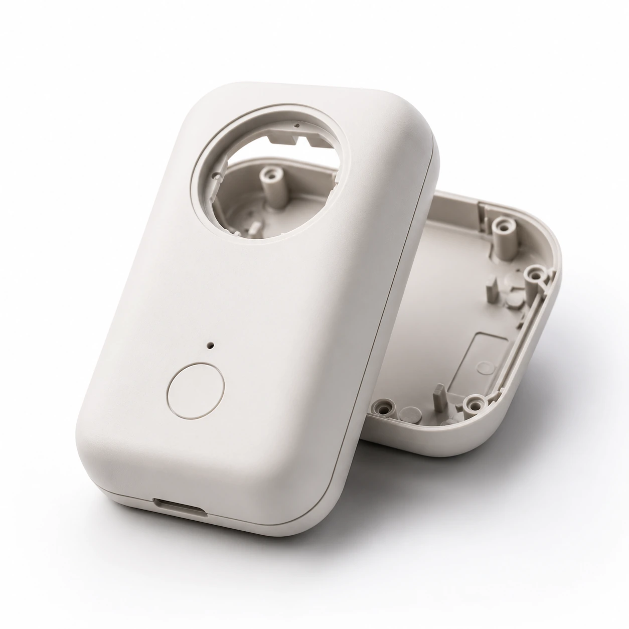 ABS consumer product housing with rounded shell internal mounting posts and clean surface finish