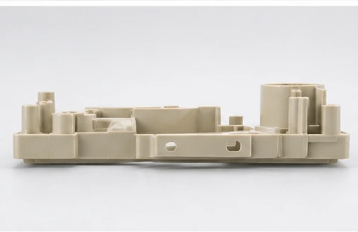Side view of injection molded plastic part showing wall thickness and molded structure
