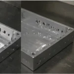 Close-up detail of CNC machined aluminum housing showing inner structure, holes, and machined finish