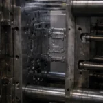 Close-up of die casting mold cavity during electronic component production