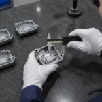 Final caliper inspection of a zinc alloy die cast electronic component